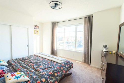 228 Windrow Link Sw, Airdrie, AB - Indoor Photo Showing Bedroom
