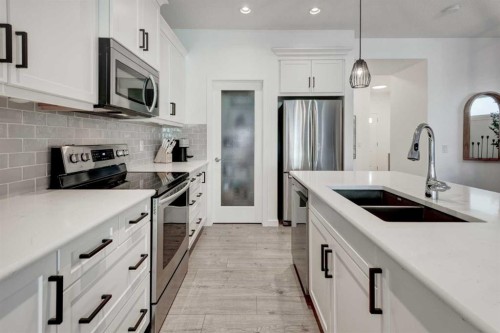 236 Auburn Glen Close Se, Calgary, AB - Indoor Photo Showing Kitchen With Double Sink With Upgraded Kitchen