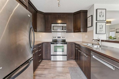 100 Sage Valley Drive Nw, Calgary, AB - Indoor Photo Showing Kitchen With Double Sink