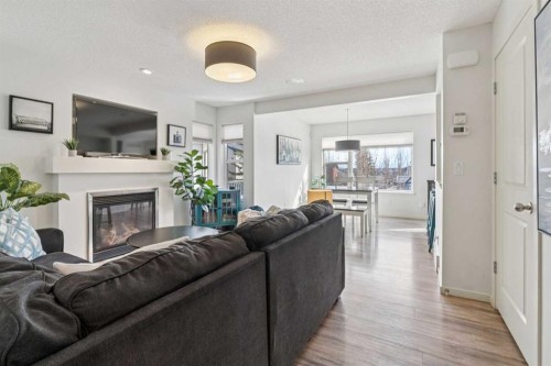 100 Sage Valley Drive Nw, Calgary, AB - Indoor Photo Showing Living Room With Fireplace
