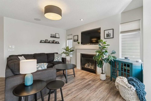 100 Sage Valley Drive Nw, Calgary, AB - Indoor Photo Showing Living Room With Fireplace