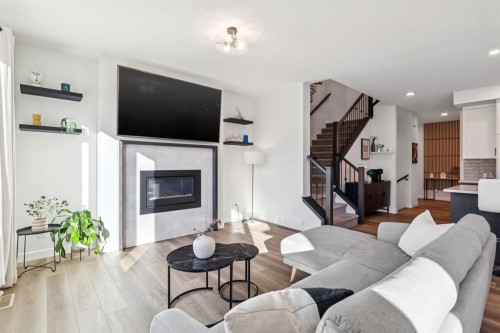 170 Creekstone Path Sw, Calgary, AB - Indoor Photo Showing Living Room With Fireplace