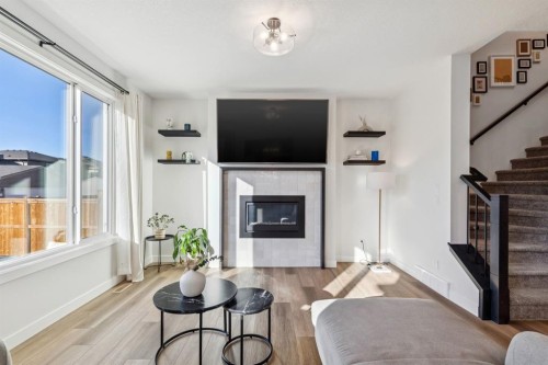 170 Creekstone Path Sw, Calgary, AB - Indoor Photo Showing Living Room With Fireplace