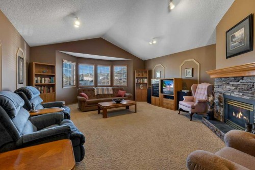 123 Valley Glen Bay Nw, Calgary, AB - Indoor Photo Showing Living Room With Fireplace