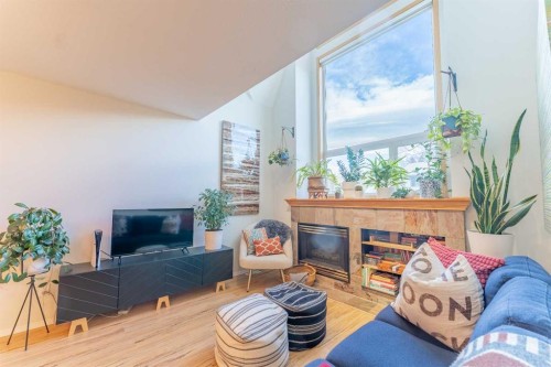 2-601 4Th Street, Canmore, AB - Indoor Photo Showing Living Room With Fireplace