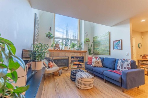 2-601 4Th Street, Canmore, AB - Indoor Photo Showing Living Room With Fireplace