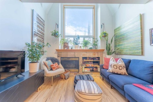 2-601 4Th Street, Canmore, AB - Indoor Photo Showing Living Room With Fireplace