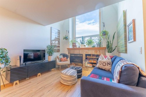 2-601 4Th Street, Canmore, AB - Indoor Photo Showing Living Room With Fireplace