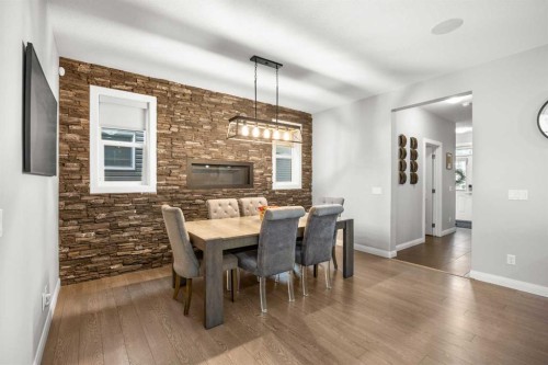 40 Evansfield Place Nw, Calgary, AB - Indoor Photo Showing Dining Room With Fireplace