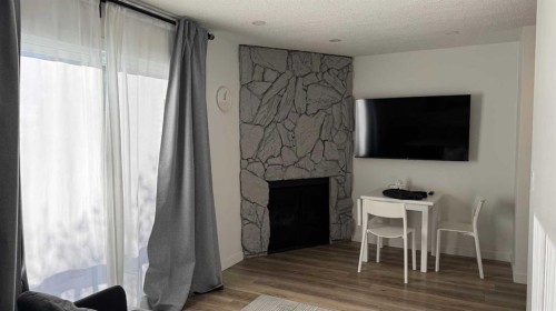 2820 16 Avenue Se, Calgary, AB - Indoor With Fireplace