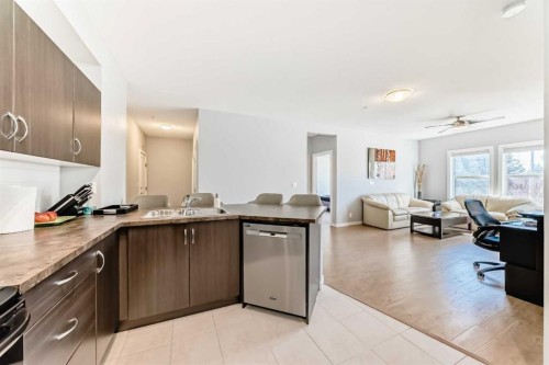 107-100 Cranfield Common Se, Calgary, AB - Indoor Photo Showing Kitchen With Double Sink