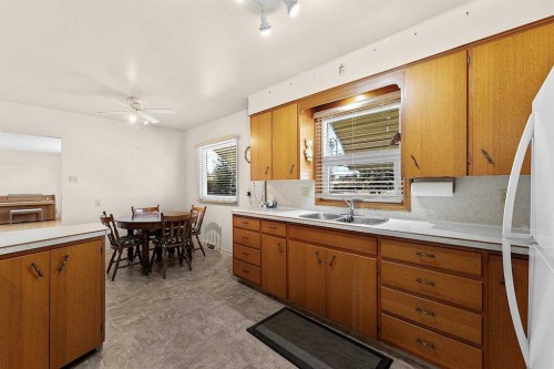 96 2 Street Se, High River, AB - Indoor Photo Showing Kitchen With Double Sink