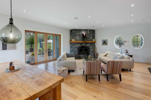 84 Eagle Butte Ranch, Rural Rocky View County, AB - Indoor Photo Showing Living Room With Fireplace