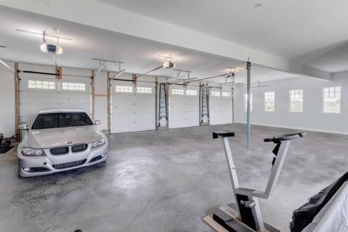 84 Eagle Butte Ranch, Rural Rocky View County, AB - Indoor Photo Showing Garage