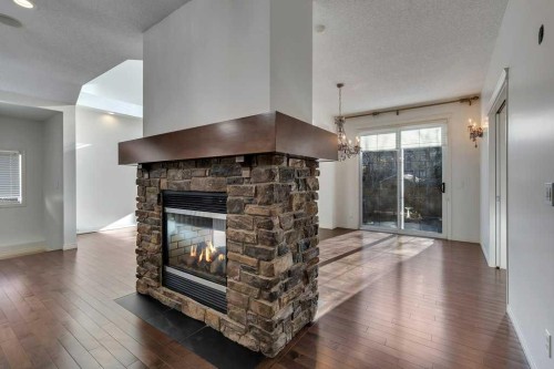 218 Valley Woods Place Nw, Calgary, AB - Indoor Photo Showing Living Room With Fireplace