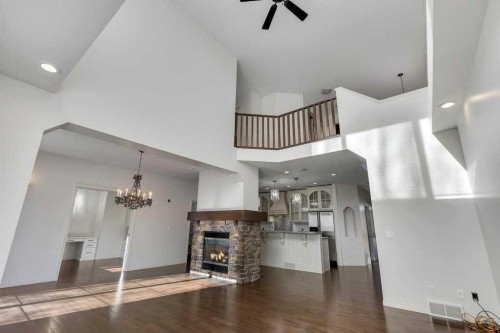 218 Valley Woods Place Nw, Calgary, AB - Indoor With Fireplace