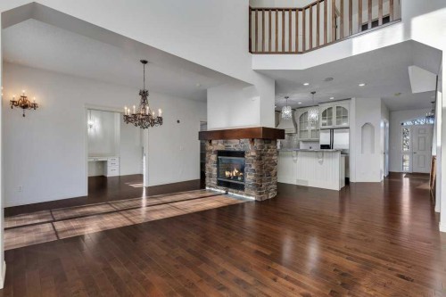 218 Valley Woods Place Nw, Calgary, AB - Indoor Photo Showing Living Room With Fireplace