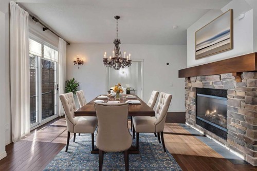 218 Valley Woods Place Nw, Calgary, AB - Indoor Photo Showing Dining Room With Fireplace