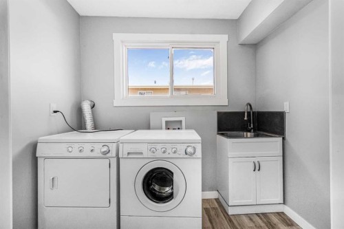 183 Penbrooke Close Se, Calgary, AB - Indoor Photo Showing Laundry Room