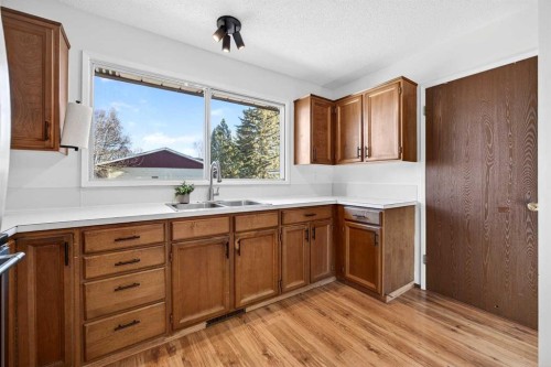 208 Silver Valley Rise Nw, Calgary, AB - Indoor Photo Showing Kitchen With Double Sink