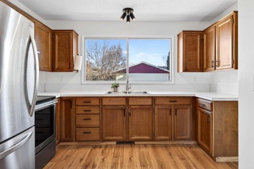 208 Silver Valley Rise Nw, Calgary, AB - Indoor Photo Showing Kitchen With Double Sink