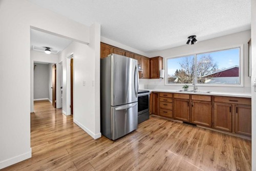 208 Silver Valley Rise Nw, Calgary, AB - Indoor Photo Showing Kitchen With Double Sink