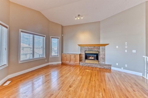 180 Hidden Vale Close Nw, Calgary, AB - Indoor Photo Showing Living Room With Fireplace