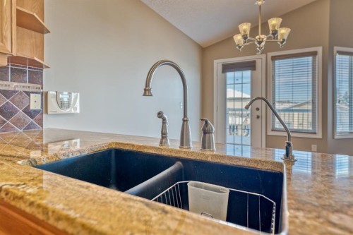 180 Hidden Vale Close Nw, Calgary, AB - Indoor Photo Showing Kitchen With Double Sink