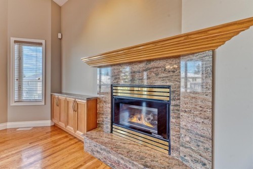 180 Hidden Vale Close Nw, Calgary, AB - Indoor With Fireplace