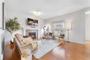 295 Prairie Springs Crescent Sw, Airdrie, AB  - Indoor Photo Showing Living Room With Fireplace 