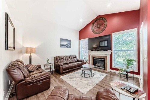 187 Hawkmere View, Chestermere, AB - Indoor Photo Showing Living Room With Fireplace