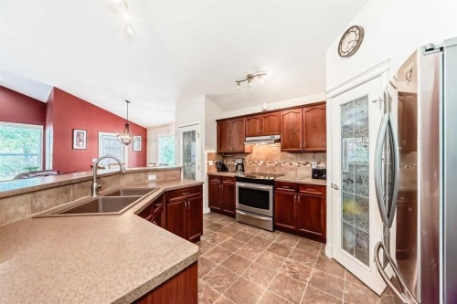 187 Hawkmere View, Chestermere, AB - Indoor Photo Showing Kitchen With Stainless Steel Kitchen With Double Sink