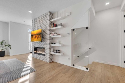 247 Greenbriar Common Nw, Calgary, AB - Indoor Photo Showing Other Room With Fireplace