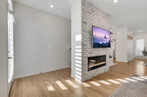 247 Greenbriar Common Nw, Calgary, AB - Indoor Photo Showing Living Room With Fireplace