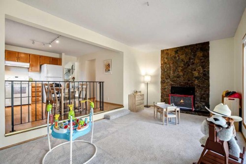 220 Scenic Way Nw, Calgary, AB - Indoor With Fireplace