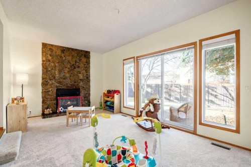 220 Scenic Way Nw, Calgary, AB - Indoor With Fireplace