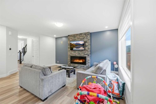 228 Carringham Road, Calgary, AB - Indoor Photo Showing Other Room With Fireplace