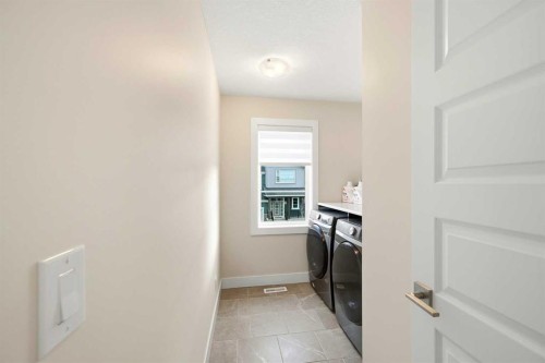228 Carringham Road, Calgary, AB - Indoor Photo Showing Laundry Room
