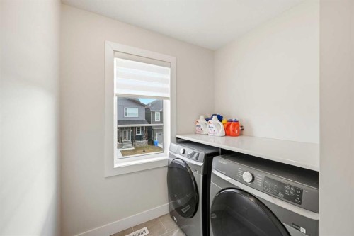 228 Carringham Road, Calgary, AB - Indoor Photo Showing Laundry Room