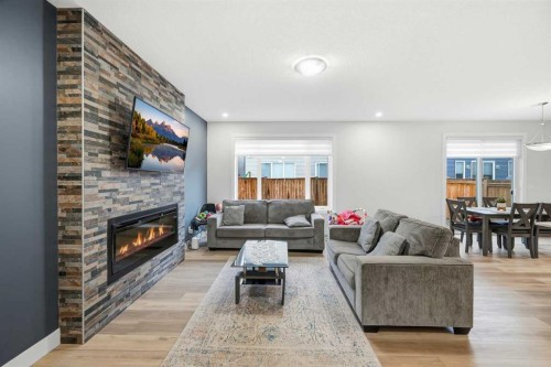 228 Carringham Road, Calgary, AB - Indoor Photo Showing Living Room With Fireplace