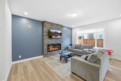 228 Carringham Road, Calgary, AB - Indoor Photo Showing Living Room With Fireplace