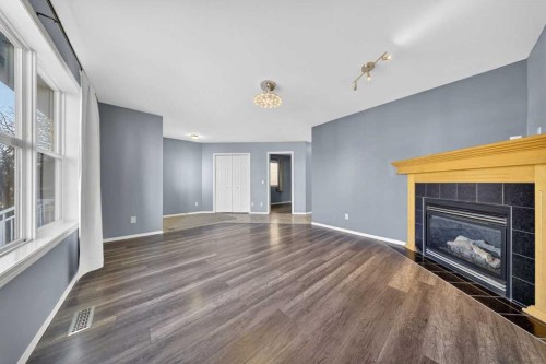 83 Tarington Way Ne, Calgary, AB - Indoor Photo Showing Living Room With Fireplace