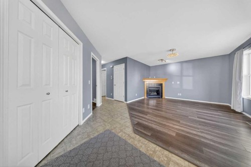83 Tarington Way Ne, Calgary, AB - Indoor Photo Showing Other Room With Fireplace