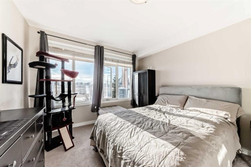 206-1005B Westmount Drive, Strathmore, AB - Indoor Photo Showing Bedroom