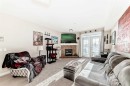 206-1005B Westmount Drive, Strathmore, AB  - Indoor Photo Showing Living Room With Fireplace 