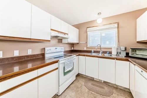 329 Martinwood Place Ne, Calgary, AB - Indoor Photo Showing Kitchen With Double Sink
