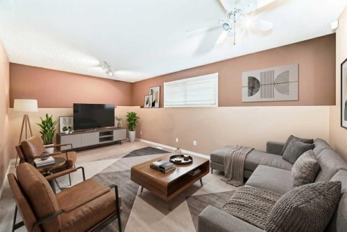 329 Martinwood Place Ne, Calgary, AB - Indoor Photo Showing Living Room