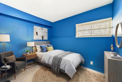 329 Martinwood Place Ne, Calgary, AB - Indoor Photo Showing Bedroom