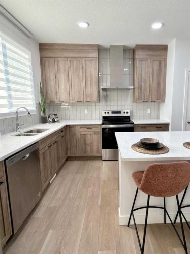 83 Legacy Passage Se, Calgary, AB - Indoor Photo Showing Kitchen With Double Sink