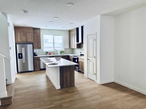 83 Legacy Passage Se, Calgary, AB - Indoor Photo Showing Kitchen With Double Sink